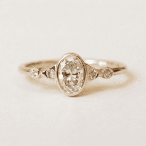Oval and Triangles Diamond Ring